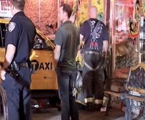 Cab Jumps Curb, Six People Hurt