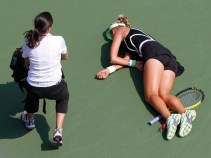 Player Collapses in Heat at Open
