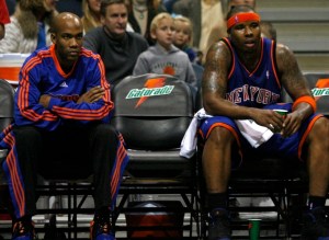 New York Knicks' Stephon Marbury, left, and Quentin Richardson, center watch as the Knicks take on the Milwaukee Bucks.