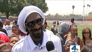"Call Me Coach Snoop": Rapper Sponsors Football Day for Kids