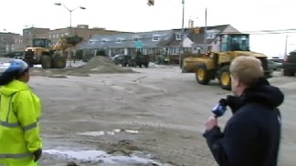 Cleaning Up Sand After Storm in Long Beach