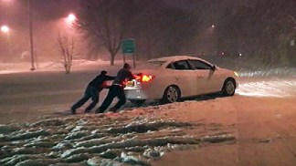 Snow Traps Cars on Roads, Shuts Down Highways