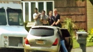 Raw Video: 2 Taken From Medford Home in Handcuffs