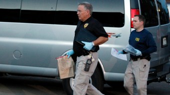Investigators Probe Holmes' Apartment