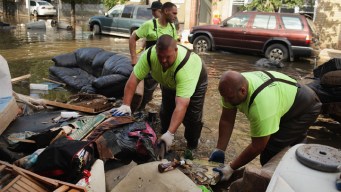 As Water Recedes, Cleanup Begins