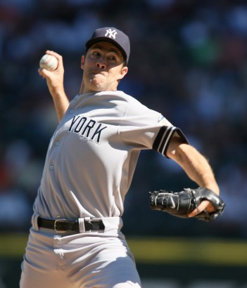 New York Yankees' Mike Mussina pitches to the Seattle Mariners during the first inning of a baseball game in Seattle. New York Yankees' Mike Mussina pitches to the Seattle Mariners during the first inning of a baseball game in Seattle.
