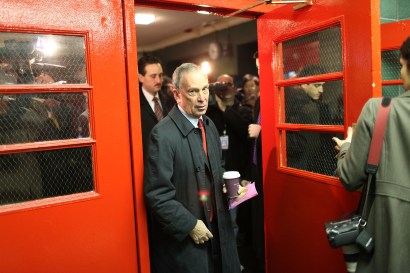 Coffee in hand, Mayor Michael Bloomberg exits a school after voting at an Upper East Side school. 