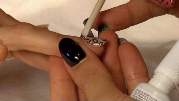 Megan checks out on of this season's edgiest trends -- nail art, with a leopard print manicure at <a href=