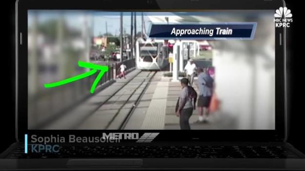 Boy Dodges Train at Last Minute