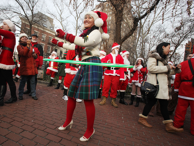 A Storm of Santas Descend Upon New York