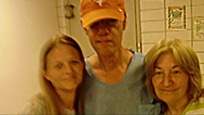While spending the night behind bars, country superstar Randy Travis found time to take pictures with fans at the Grayson County Jail.