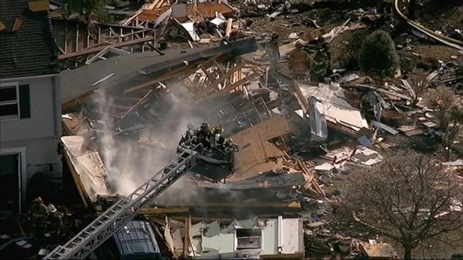 Chopper footage captures first responders battling a blaze following a house explosion in West Haverstraw, N.Y.