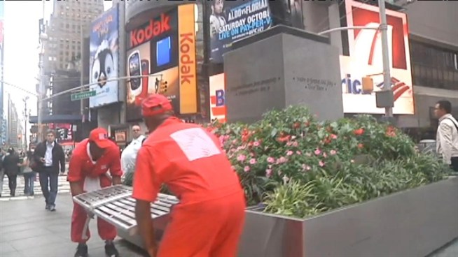 A plan to improve Times Square, New York's best-known landscape, includes laying a concrete floor, removing dozens of street lamps and installing permanent benches. Roseanne Colletti reports.