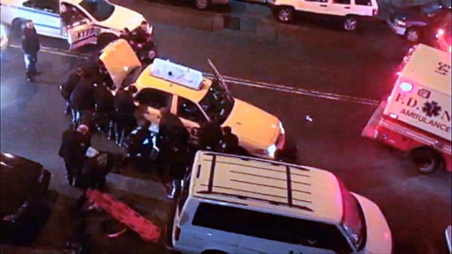 Video shows police officers lifting a taxi off of a pedestrian in the Bronx on Sunday. The man is in critical condition.