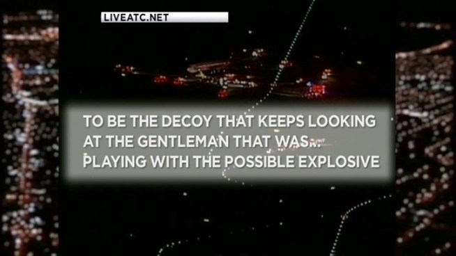 A Delta plane bound for Madrid returned to Kennedy Airport after a passenger found a cut wire in the lavatory Thursday night, sources familiar with the situation said.