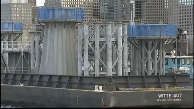 A barge was brought across New York Harbor from New Jersey's Port Newark on Tuesday. It held nine pieces of the steel spire that will top One World Trade Center in lower Manhattan. News 4's Katherine Creag reports.