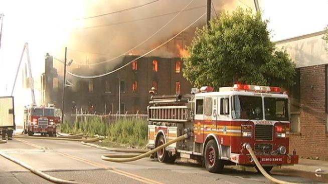 Camden officials are investigating a fire that tore through an abandoned chemical warehouse, the third major fire in the city this month.