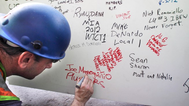 Workers and visitors to the new One World Trade Center building in New York are leaving their personal marks on the concrete and steel. Graffiti art appears on beams, walls and stairwells of the skyscraper that's rising to replace the destroyed twin towers.