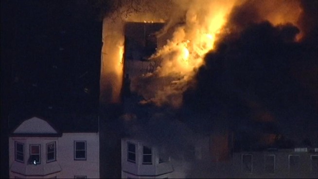 Firefighters are battling a massive fire in Irvington, N.J.