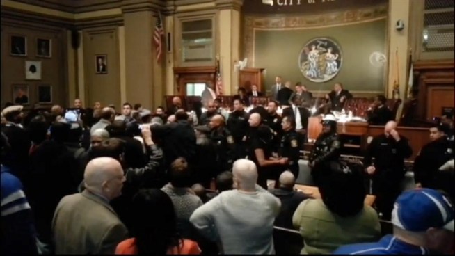 Chaos breaks out a Newark City Council meeting Tuesday, Nov. 20, after Mayor Cory Booker cast a deciding vote for Shanique Davis Speight over John Sharpe James, the son of former city mayor Sharpe James.