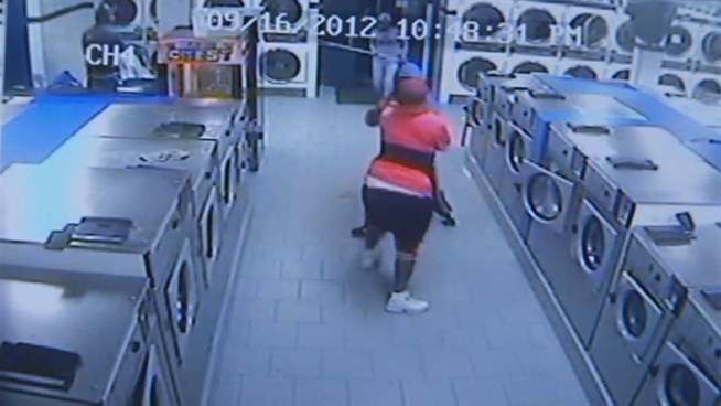 Four people, some of whom may be teenagers, are wanted for robbing a laundromat and attacking a worker inside.  John Noel reports
