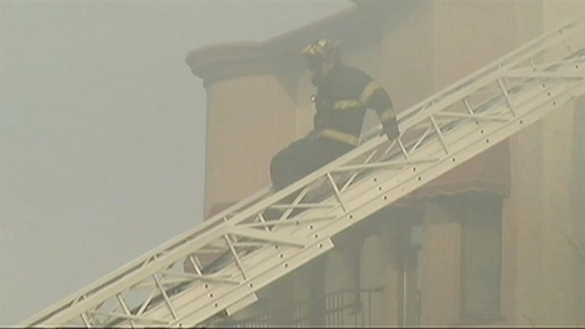Firefighters battled a heavy fire in North Bergen, N.J., that erupted in a strip of buildings Wednesday along Broadway and briefly trapped a woman who had to be rescued. Ida Siegal reports.