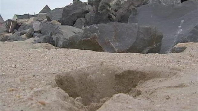 A dozen or so sinkholes have formed along a New Jersey beach, terrifying one resident who fell in and alarming officials who visited the swath of coastline Thursday. Brian Thompson reports.