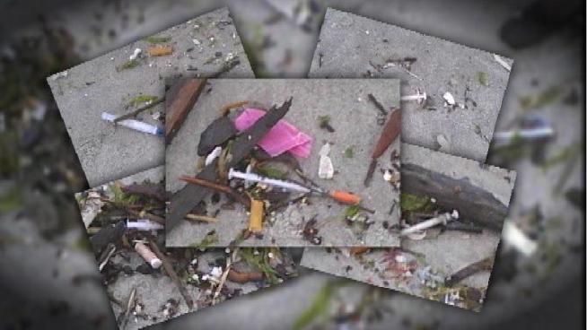 The city Parks Department cleaned up a stretch of Rockaway Beach in Queens Monday after NBC 4 New York contacted the agency about medical waste, including syringes, littering the shore. Katy Tur reports.