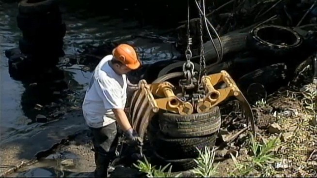 Workers removed hundreds of tires from the Passaic River during a scheduled cleanup. Brian Thompson helped out.