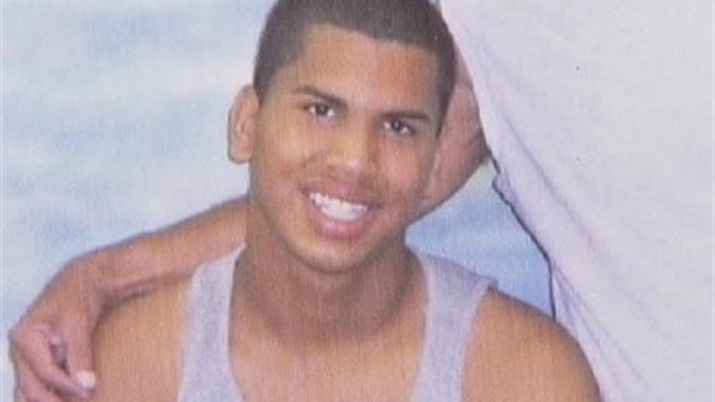 Police are searching for four men in connection with an armed robbery that left a 17-year-old dead and a 15-year-old wounded in a northern New Jersey park.