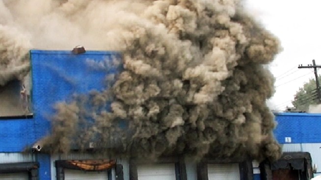 Firefighters were continuing to fight a four-alarm blaze in a vacant factory building in Brooklyn Monday night. The burning wreckage at 3250 Fulton St. in Cypress Hills turned out to be nine interconnected buildings, part of the former Blue Ridge Farms Food processing plant. Andrew Siff reprots.