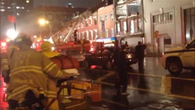 Firefighters respond to a building collapse at 15th Street and  8th Avenue in the Meatpacking District Monday evening.