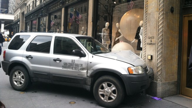 An SUV jumped the curb in front of Saks Fifth Avenue Tuesday, striking a pedestrian in front of the store.