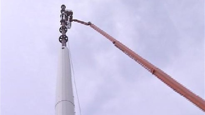 Residents of one Long Island neighborhood are up in arms over a giant cell phone tower being built right next to their homes. Greg Cergol has the story.