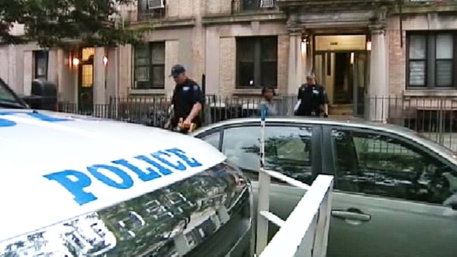 Police say a man armed with a box cutter grabbed the woman from behind as she waited for a cab, then dragged her to the roof and raped her. Ida Siegal reports.