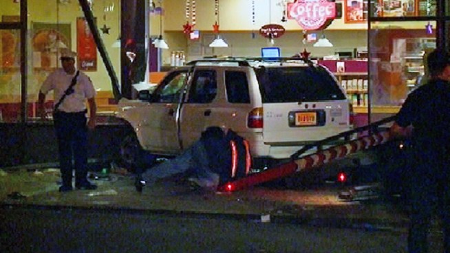 An SUV plowed into a Dunkin' Donuts store in Jersey City Monday, hurting 7 people. Ida Siegal reports.