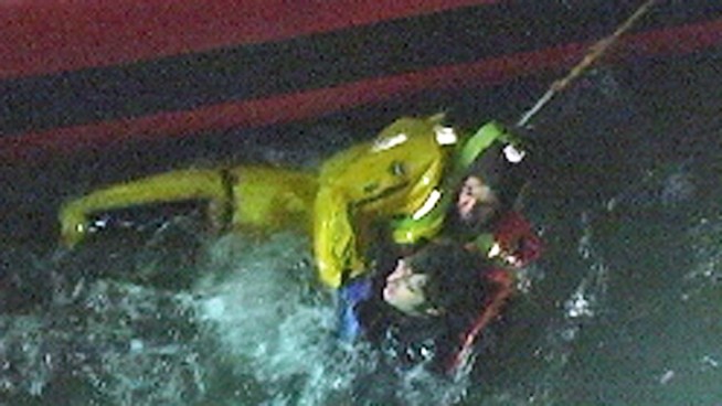 Police and firefighters helped retrieve a man in the East River Thursday night. Watch this dramatic raw video of a member of Marine 6 diving in to get the man.