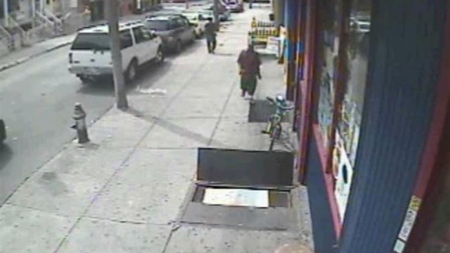 Police are searching for this man, accused of pushing a 9-year-old boy, robbing him, then fleeing on a bike in the Fordham section of the Bronx Wedneday, Aug. 8. Anyone with information is asked to contact NYPD Crime Stoppers at 800-577-TIPS.