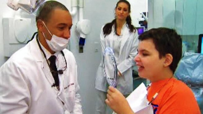 A local dentist brought some Christmas cheer to a young cancer survivor just in time for the holidays.