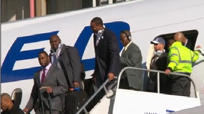 Super Bowl XLVI champions New York Giants return home Monday. Here they are getting off the plane at Newark Airport.