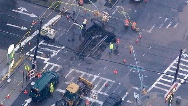 The nonstop rain around our area has locals damp, tired, and frustrated. One woman escaped serious injury when she slipped into an open manhole near Fourth Avenue in Brooklyn. The murky water concealed the gap in the street, hiding the danger beneath to pedestrians. In Staten Island, the rapid waters undermined the soil and created a massive sinkhole on the service road on Narrows Road North. Traffic was diverted while crews worked to fill the street. NBC New York's Chris Glorioso has more on how the soggy summer storm affected our area.