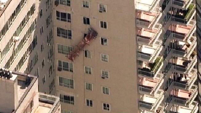 Scaffolding on the Upper East Side dropped on one side, and a high-rise rescue had to be performed. John Noel reports.