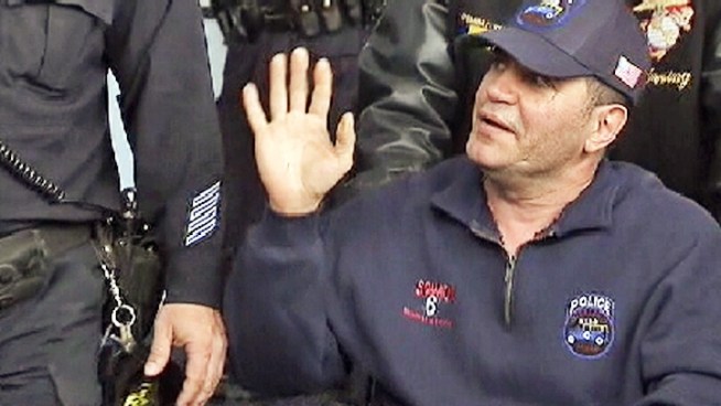 One of the four police officers wounded in a Brooklyn shootout Sunday was released from the hospital, hailed as a hero for jumping to protect his fellow officers in the line of fire. Andrew Siff reports.