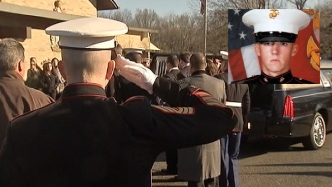 Hundreds of people packed a central New Jersey church for the funeral of Kevin Reinhard, a Marine corporal killed in a helicopter crash in Afghanistan.
