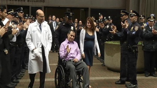 NYPD officer Officer Eder Loor, stabbed in the head and slashed in the neck and face while responding to a 911 call last month, left the hospital Wednesday in front of a police honor guard and applauding hospital staff. Roseanne Colletti reports.
