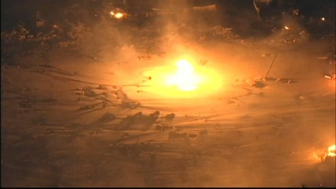 NBC 4 New York chopper footage shows flames raging through Mantoloking, where natural gas rekindled fires that already destroyed more than a dozen homes.