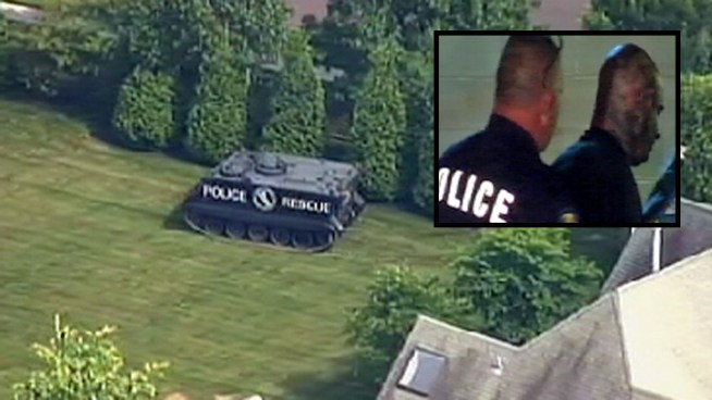 The off-duty New Jersey police officer arrested at his estranged wife's Philadelphia-area home faces 13 counts of attempted homicide following a 10-hour standoff in which he opened fire with a high-powered rifle. This is raw video from after the standoff.