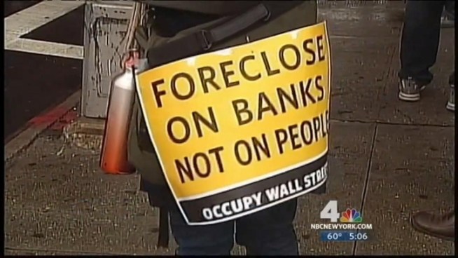 Occupy Wall Street protesters took to the streets of East New York in Brooklyn Tuesday to make a statement against the foreclosure crisis.