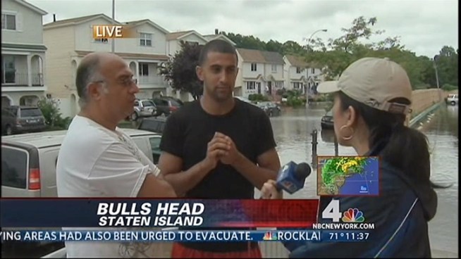 Firefighters rescued dozens of people by boat on Sunday as Irene passed through New York City. 