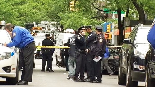 A knife-wielding man was shot by police officers responding to a domestic dispute on the Upper East Side Monday afternoon, law enforcement sources said. The suspect's mother was also struck by the gunfire. Andrew Siff reports.